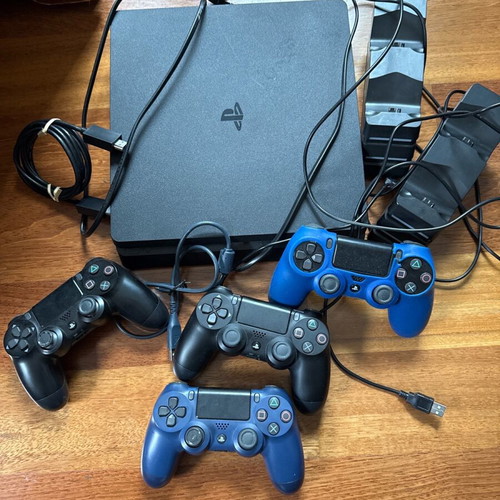 PlayStation 4 (PS4) like new with 2 charging stations, 4 controllers and cables