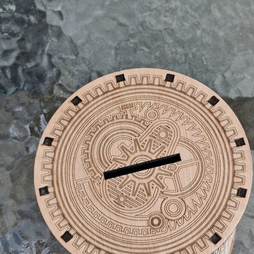 Handmade wooden laser-cut piggy bank with mechanical design
