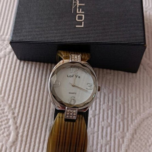 Women's watch like new with silver and bone bracelet