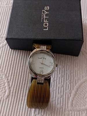 Women's watch like new with silver and bone bracelet