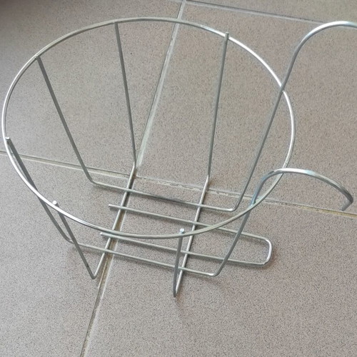 Large plastic flowerpot with saucer and metal balcony railing holder