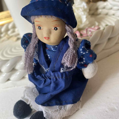 Vintage ceramic collectible doll with cloth limbs