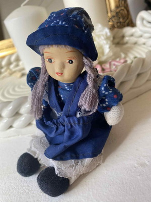 Vintage ceramic collectible doll with cloth limbs
