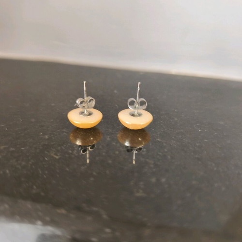 Button earrings in bright honey glossy color like new