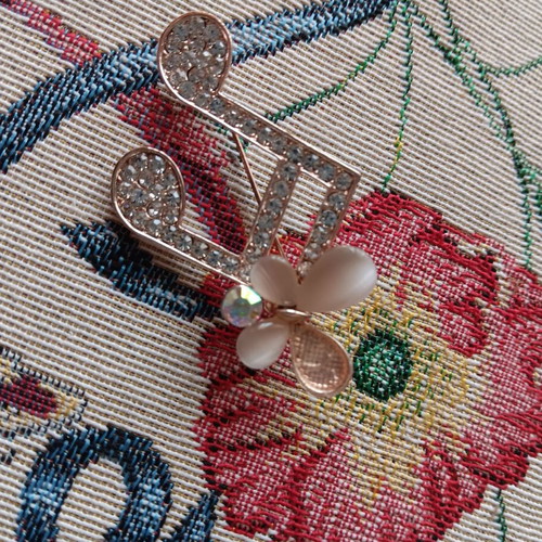 Pin used, white and gold with defect