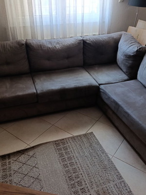 Corner sofa used, gro-beige color with wooden legs, 2.60x2.00m