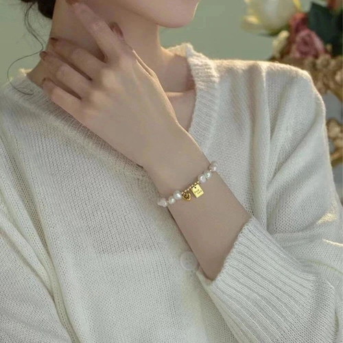 Freshwater Pearl Bracelet with Gold Good Luck Charm