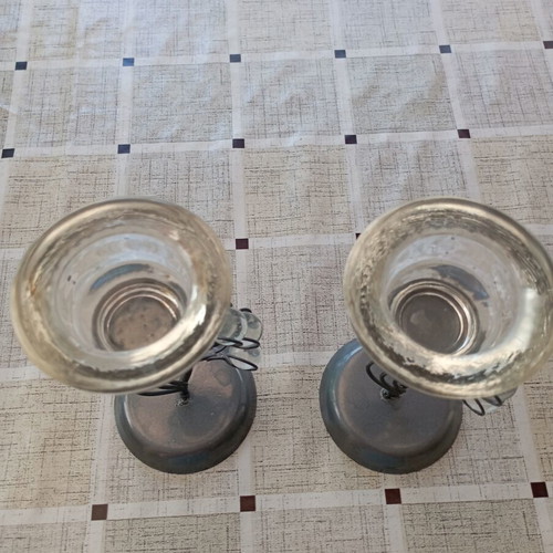 Set of table candle holders with dark metal base and crystal drop decorations