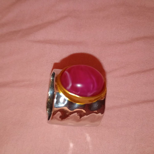 Enigma ring with pink oval stone and hammered copper metal