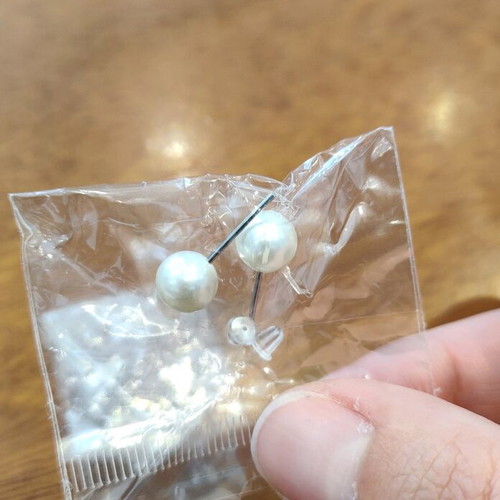 Two pairs of earrings new, pearl and infinity with silicone clasp
