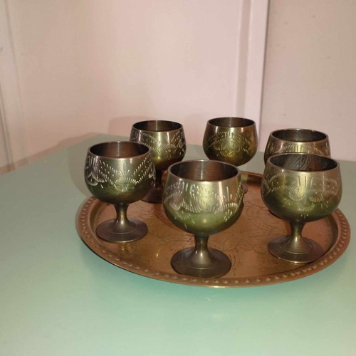 Vintage brass set with jugs, glass, and vase from India