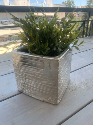 Metallic silver kaspo used with artificial plant