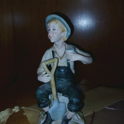 Decorative figurine like new with boy farmer and shovel