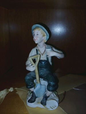 Decorative figurine like new with boy farmer and shovel