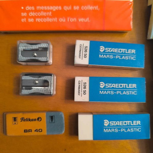 Office supplies new with sticky notes, erasers and sharpeners