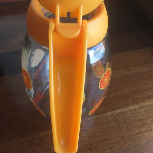 Solmazer jug like new with orange pattern and plastic lid