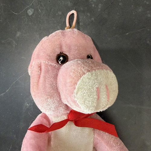 Plush pig with red bow