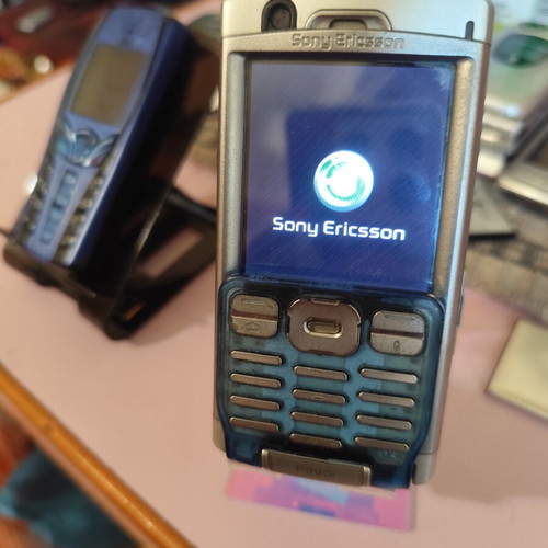 Sony Ericsson P990i vintage cell phone used with charger