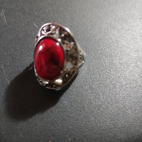 Silver-plated ring with red stone and small crystals new