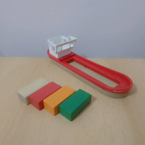 Wooden toys used with house, boat, and shapes