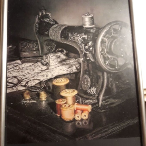 Engraving of old sewing machine with new frame