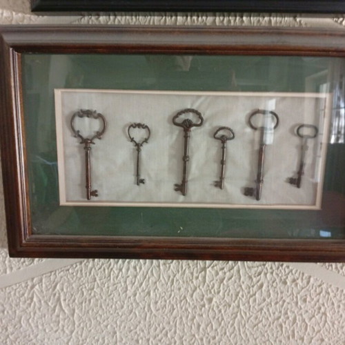 Collection of old keys new in frames for wall decoration