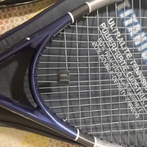 Tennis racket used with cover