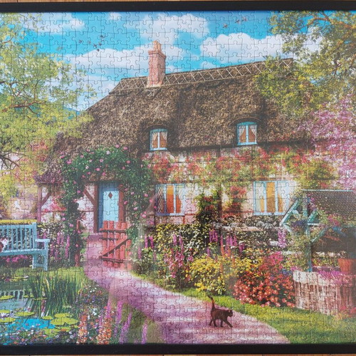 Framed puzzle like new, dimensions 0.53x0.73 m