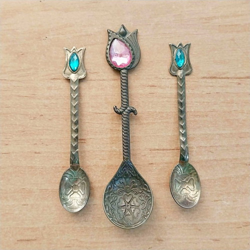 Decorative brass spoons with colored glass, set of three, used