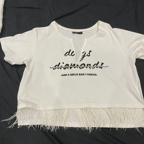 Women's blouse used, white short asymmetric with feathers