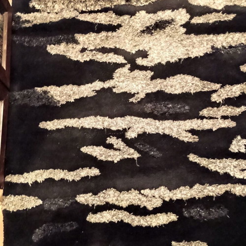 Black and silver rug with embossed designs 216x155 cm