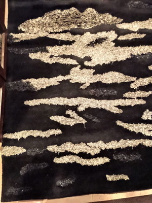 Black and silver rug with embossed designs 216x155 cm