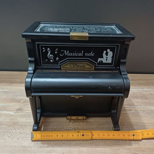 Piano music box used with compartments for small jewelry plastic