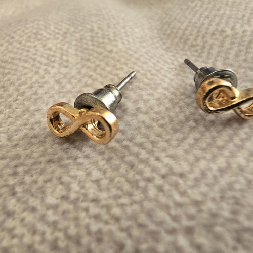 Infinity stud earrings in gold tone