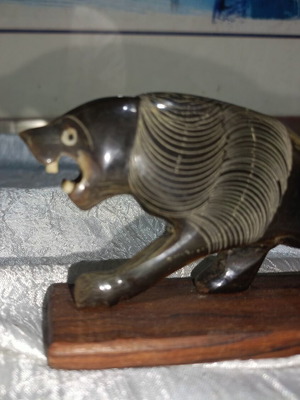 Vintage handmade lion sculpture carved from water buffalo horn