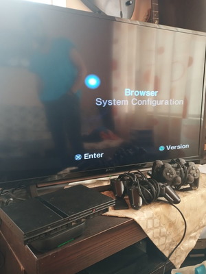 PlayStation 2 Slim console used with 4 controllers and memory card