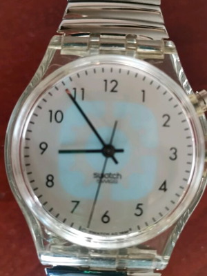 Swatch watch with illuminated dial like new