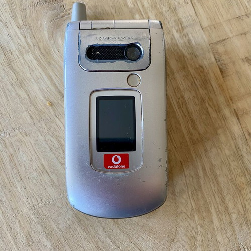 Sharp GX30 vintage clamshell phone used, iconic Vodafone Live! model
