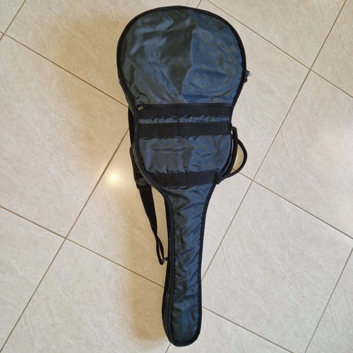 Classical guitar used with case, missing one string and small hole