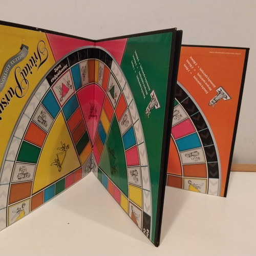 Trivial Pursuit Deluxe Edition board game used, missing blue pieces and instructions