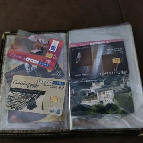 Collectible old phone cards used with album
