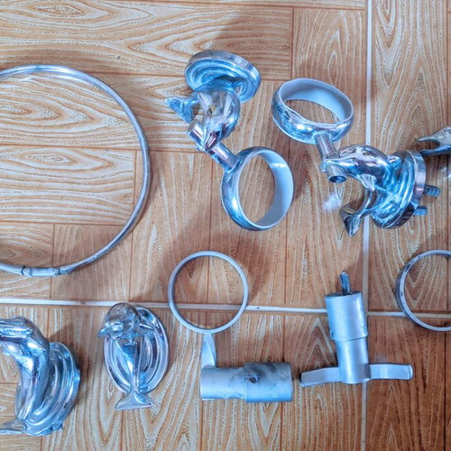Bathroom accessory set used, chrome with dolphin design and shower handset