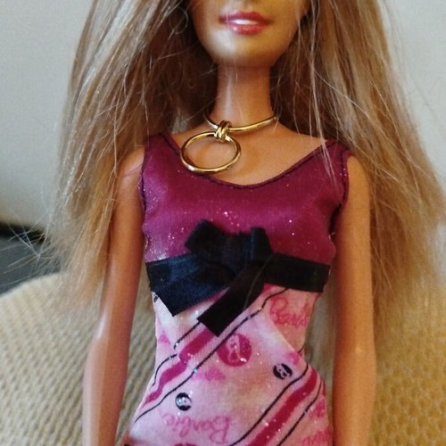 Barbie doll like new with purple dress and gold necklace from 2009 collection