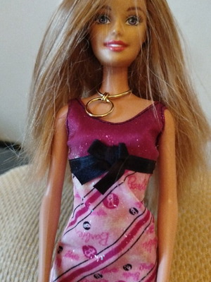 Barbie doll like new with purple dress and gold necklace from 2009 collection