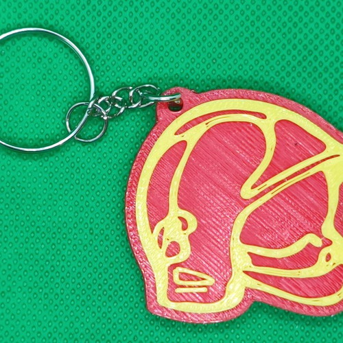 Fire helmet keychain like new with two-color print