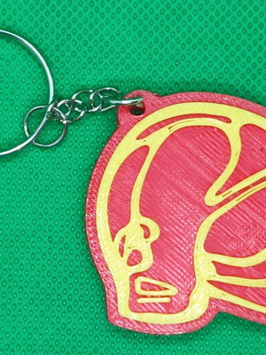 Fire helmet keychain like new with two-color print