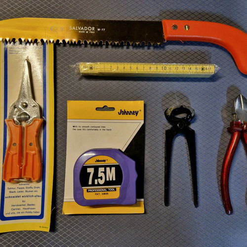 Set of 6 tools new with tape measure, scissors, saw, folding ruler, pliers and cutter