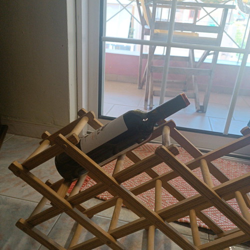 Reclining wooden wine rack used