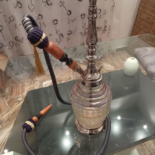 Hookah used with traditional Egyptian metal design and glass base
