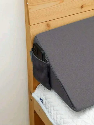 Ergonomic triangular pillow with removable cover and pocket